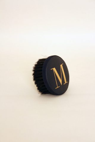 Brush with embossed letter M